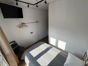A bed or beds in a room at Lotila Flats Rio Caudal