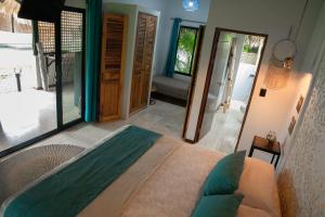 Postel nebo postele na pokoji v ubytování LA QUEBRADA ECO LODGE Hotel Boutique