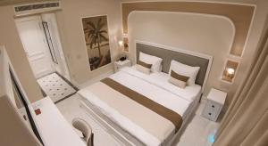 Ένα ή περισσότερα κρεβάτια σε δωμάτιο στο DBD Hotel Çeşme +8 φωτογραφίες