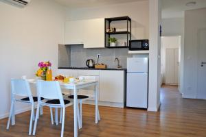 Kuchyň nebo kuchyňský kout v ubytování Apartmani Portina
