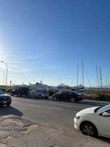 a group of cars parked on the side of a road at Casa Ondea in Marina di Pisa