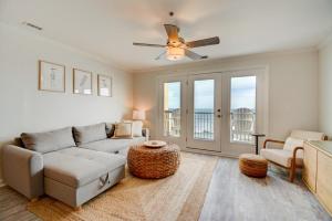 a living room with a couch and a ceiling fan at Villa Capriani 317A in North Topsail Beach