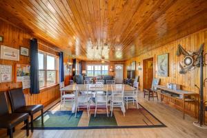 a dining room with a table and chairs at Wave To Cool in Surf City +26 photos