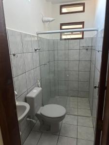 Koupelna v ubytování Apartamentos completos no centro - vista mar + 7 fotografií
