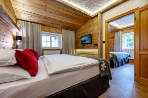 Rúm í herbergi á Hotel Olympie