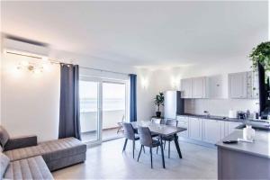a kitchen and living room with a table and chairs at Apartment in Tkon - Insel Pasman 50975 in Tkon