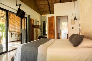 Postel nebo postele na pokoji v ubytování LA QUEBRADA ECO LODGE Hotel Boutique