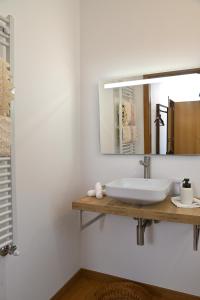 a bathroom with a sink and a mirror at Quinta da Aldeia Nova in Arganil +39 photos