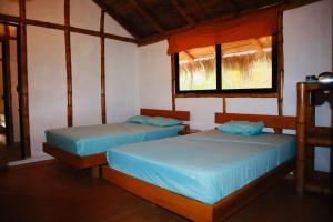 Postel nebo postele na pokoji v ubytování Eco Hotel Campestre Atlantis San Joaquín La Mesa + 37 fotografií