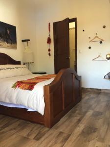 Postel nebo postele na pokoji v ubytování Cuadra Casona el Calvario