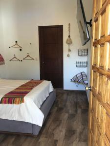 Postel nebo postele na pokoji v ubytování Cuadra Casona el Calvario
