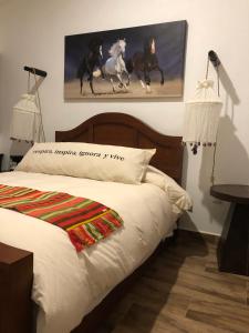 Postel nebo postele na pokoji v ubytování Cuadra Casona el Calvario