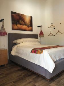 Postel nebo postele na pokoji v ubytování Cuadra Casona el Calvario