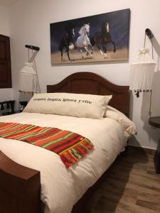 Postel nebo postele na pokoji v ubytování Cuadra Casona el Calvario