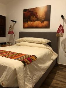 Postel nebo postele na pokoji v ubytování Cuadra Casona el Calvario