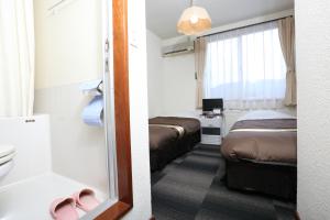 Postel nebo postele na pokoji v ubytování Alpine Wind