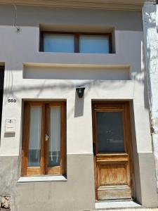 two doors on the side of a building at Loft en Las Flores in Las Flores