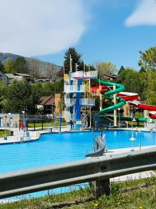 a large water park with a water slide at Sport Court! Hot Tub! Putting Green! Bunk Room! in Lava Hot Springs