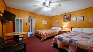 En eller flere senge i et værelse på Arrowhead 09 Deluxe