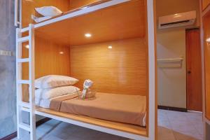 a bedroom with a bunk bed in a room at Tahan Hostel in Puerto Princesa City +18 photos