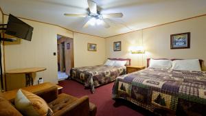 En eller flere senge i et værelse på Arrowhead 11 Deluxe