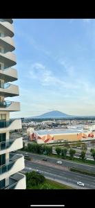 a view of a city with a building and a highway at Sam's Chic Space - An Aesthetic Getaway in Angeles