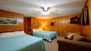 En eller flere senge i et værelse på Arrowhead 15 Deluxe