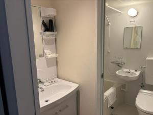 Koupelna v ubytování 里沼リゾート　Hotel KOMORINU