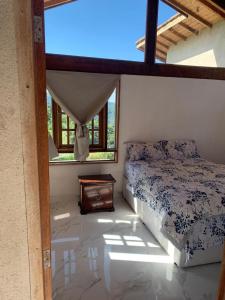 Katil atau katil-katil dalam bilik di Recanto dos Tucanos