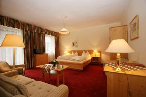 Postel nebo postele na pokoji v ubytování Ferienhotel Alber
