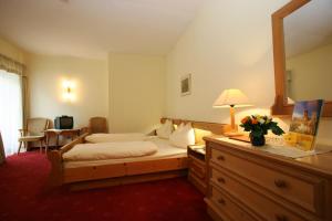 Posteľ alebo postele v izbe v ubytovaní Ferienhotel Alber