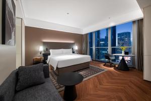 Voodi või voodid majutusasutuse IntercityHotel Shenzhen Bay -Free laundry & Free MiniBar toas