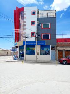 a building with a car parked in front of it at Hotel Salty House in Uyuni