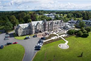 an aerial view of a large building with a parking lot at Breaffy House Hotel and Spa in Castlebar