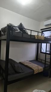 a couple of bunk beds in a room at Kaway Homestay in Butuan +2 photos