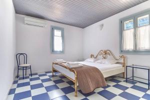 En eller flere senge i et værelse på Ocean Villa in Paros