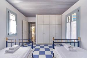 En eller flere senge i et værelse på Ocean Villa in Paros