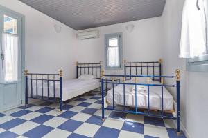 En eller flere senge i et værelse på Ocean Villa in Paros + 7 billeder