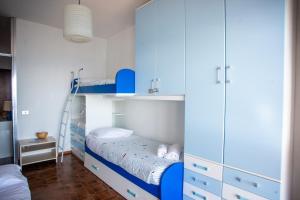 Кровать или кровати в номере Sole Surf E Relax - Happy Rentals