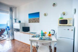 Кухня или мини-кухня в Sole Surf E Relax - Happy Rentals
