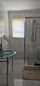 a bathroom with a glass table and a shower at The Adante in Buffelsbadden +23 photos