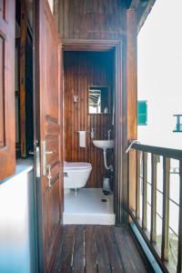 a bathroom with a toilet and a sink at The Bougainvillea in Skopelos Town +27 photos