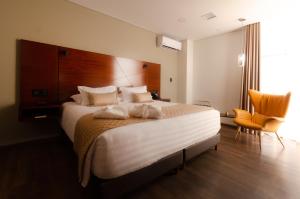 Postel nebo postele na pokoji v ubytování Hotel Mitru Sur
