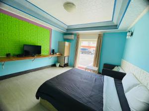 TV a/nebo společenská místnost v ubytování 大潭山莊 Da Tan Mountain INN