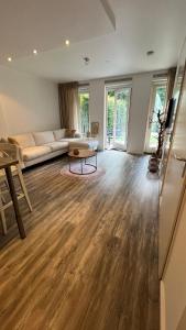 a living room with a couch and a table at GelreDroom in Arnhem