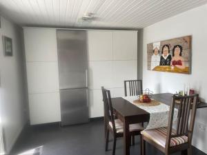 a dining room with a table and some chairs at Ferienhaus Mathilda in Kusel