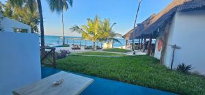 a view of the beach from a house at AVO Boutique Hotel in Dikoni