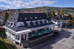 an overhead view of a white building with a store at Hotel Lane in Sjenica