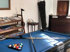 a room with a pool table with balls on it at AVO Boutique Hotel in Dikoni