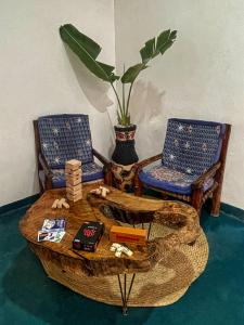 a room with two chairs and a table with a tableablish at AVO Boutique Hotel in Dikoni